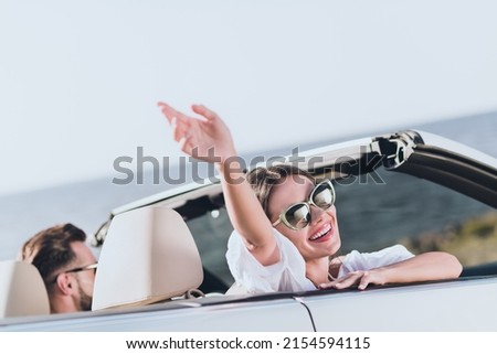 Photo of sweet pretty husband wife wear casual clothes riding cabriolet enjoying sunshine outside countryside