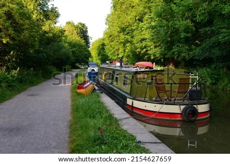 Scenic view of narrow boats on the Kennet and Avon Canal in Wiltshire England Royalty-Free Stock Photo #2154627659
