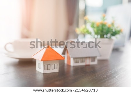 Real estate model house on the desk, Real estate trading ideas, business property concept.