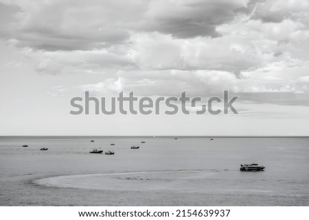 Sea landscape with boats in black and white