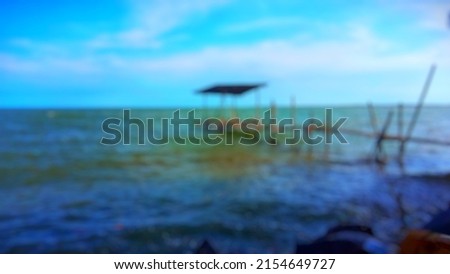 defocus,the beauty of the sea land there is an angler's hut in the ocean, during the day, Brebes Central Java Indonesian.