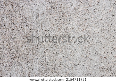 Peeling plaster on an old painted wall. texture background. Gray concrete texture with colorful spots, for add text or work design for backdrop product. top view