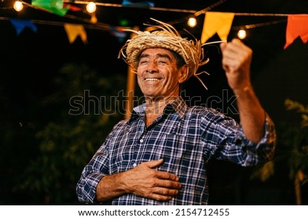 Senior man during typical Brazilian Festa Junina Royalty-Free Stock Photo #2154712455