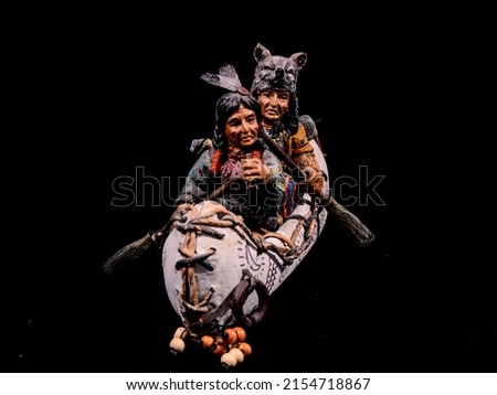 North American Indian Canoe Statue on a Black Background