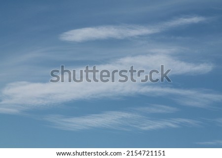 Cirrocumulus lenticularis clouds. Blue sky with white clouds Royalty-Free Stock Photo #2154721151
