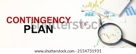 Blank note pad with CONTINGENCY PLAN text on the white background Royalty-Free Stock Photo #2154731931