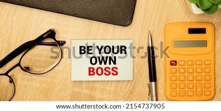 The phrase Be Your Own Boss in red text on a yellow sticky note as an incentive to take control of your business and be an entrepreneur
