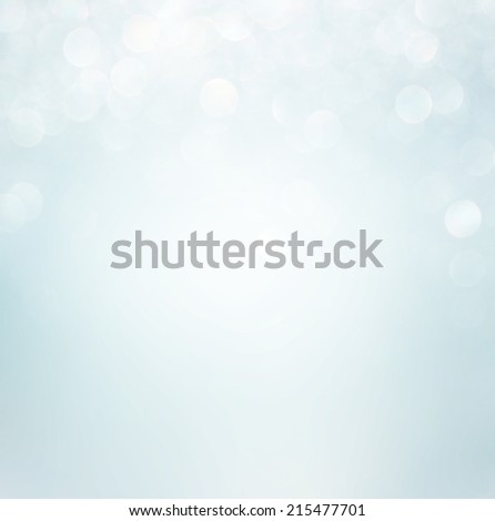 white bokeh lights background. blurred abstract image. snow or winter concept.