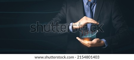 Businessman or trader is showing a growing virtual hologram stock, invest in trading.progress  success Stock Market Investments Funds and Digital Assets concept.