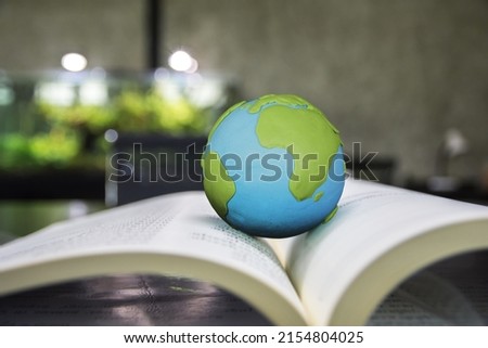 World globe on text book. Graduate study abroad programs. International education school Concept.