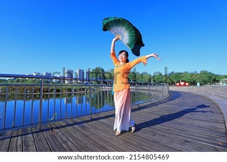 LUANNAN COUNTY, China - October 7, 2021: Ladies practice fan dance in the park, North China