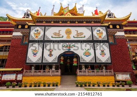 Landscape size picture of the entrance facade of the Nanwu Tibetan Temple in Kangding, Garze Tibetan Autonomous Prefecture, Sichuan, China, empty space for text