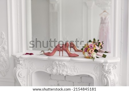 Elegant wedding accessories of the bride in the morning on the day of the celebration. Royalty-Free Stock Photo #2154845181