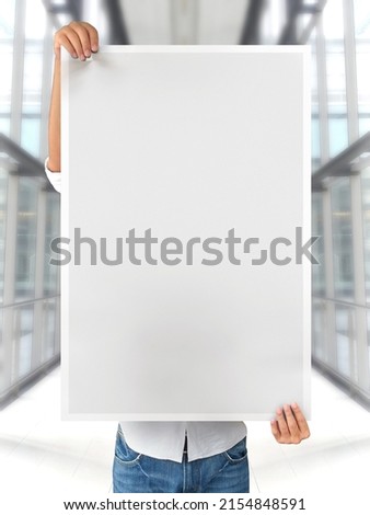 One person holding blank poster mockup