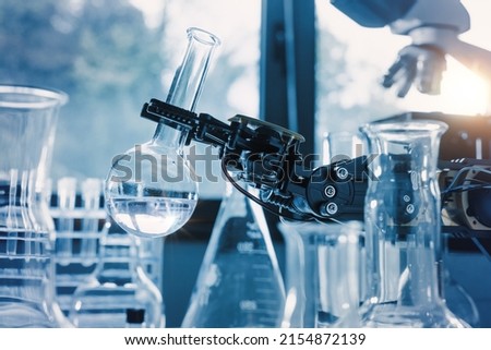 A Robot in a chemical laboratory assists humans in the most dangerous operations. Royalty-Free Stock Photo #2154872139