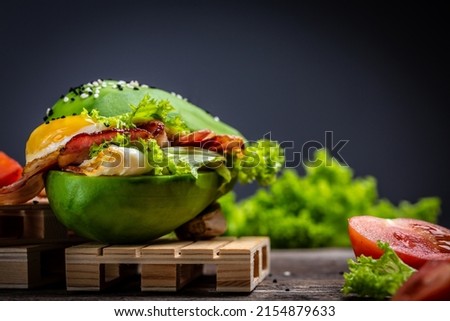 avocado burger with bacon, egg, tomato, Low carb high fat breakfast, Delicious breakfast or snack, keto paleo diet, Royalty-Free Stock Photo #2154879633