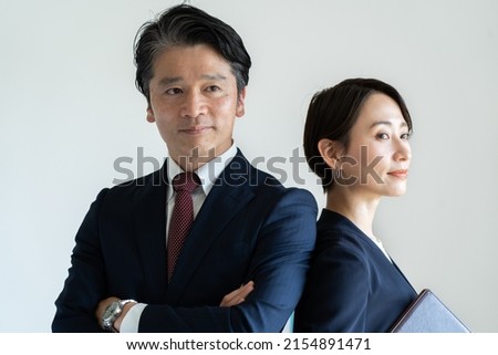 Asians in suits in their 50s