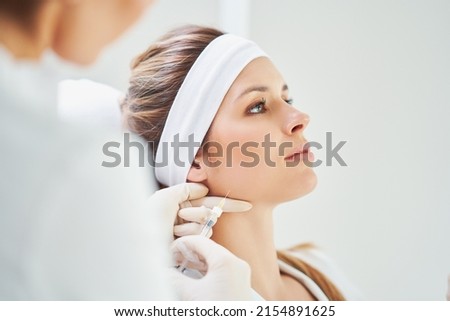 A scene of medical cosmetology treatments botulinum injection. Royalty-Free Stock Photo #2154891625