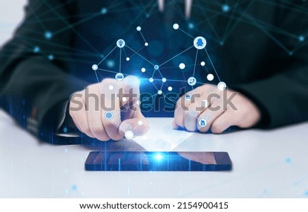 The sitting person touches the network data with his hands