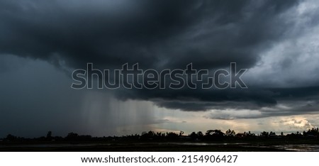 Rain clouds and black sky textured background. Danger storm cloud, Black cloud and thunder storm, Dark sky and motion clouds before rainy. Royalty-Free Stock Photo #2154906427