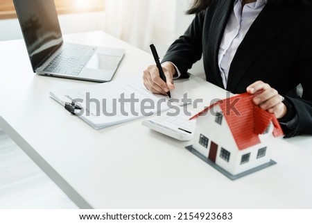 Law, agreement, contract, mortgage, woman holding a pen, reading the contract document in buying a house to see the interest rate and asking for the limit to assess the risk before buying a house