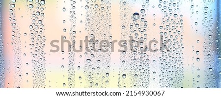 drops glass blue background abstract, transparent cold background water splashes