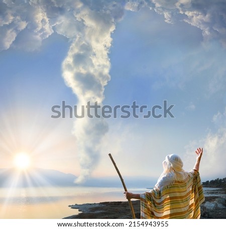 Retro holy Jesus Christ adult age wise saint male human rise arm hold wood wand rod cane back view. Middle east jew cloth Lord law torah exodus story magic egypt cloudy smoke sun light symbol concept Royalty-Free Stock Photo #2154943955
