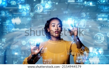 Black woman watching holographic screens. Digital transformation. Royalty-Free Stock Photo #2154944579