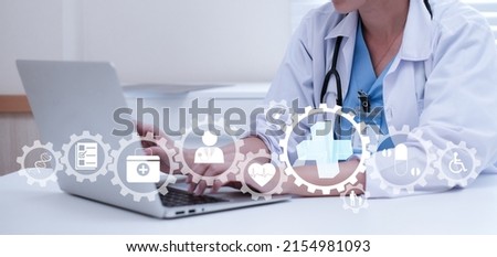 Medicine doctor and stethoscope in hand touching icon medical network connection with modern virtual screen interface, medical technology concept Doctor using digital medical futuristic interface.