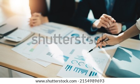 Asian business adviser meeting to analyze and discuss the situation on the financial report in the meeting room.Investment Consultant, Financial advisor and accounting concept. Royalty-Free Stock Photo #2154989693