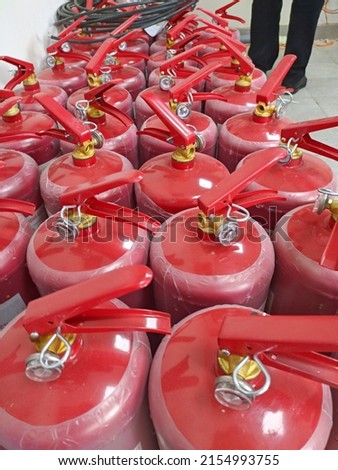 A lot of fire extinguishers. Concept of protection and security
