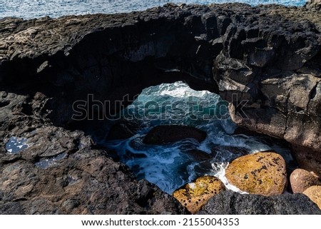 Sea Arch on Volcanic Shoreline of Keiki Beach, Hawaii Island, Hawaii, USA Royalty-Free Stock Photo #2155004353
