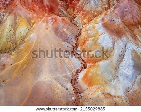 Red colorful mountains in Altai, Siberia, Russia. Aerial top down view. Kyzyl-Chin valley, also called as Mars valley. Abstract nature background Royalty-Free Stock Photo #2155029885