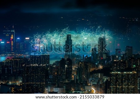 A scenic view of fireworks over the beautiful cityscape of Hong Kong at night