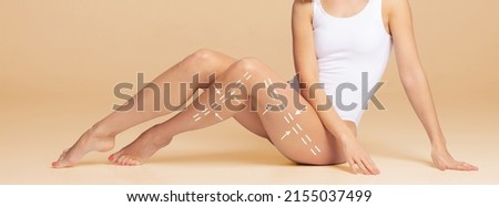 Fat lose, liposuction, sport, fitness, healthy eating, nutrition, fit shape and cellulite removal concept. Woman with arrows on body. Royalty-Free Stock Photo #2155037499