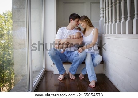 Young parents with their baby son. Image with selective focus