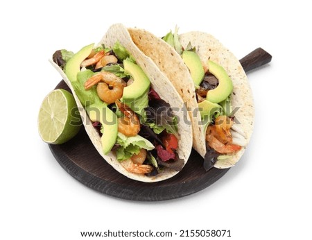 Delicious tacos with shrimps, avocado and lime on white background