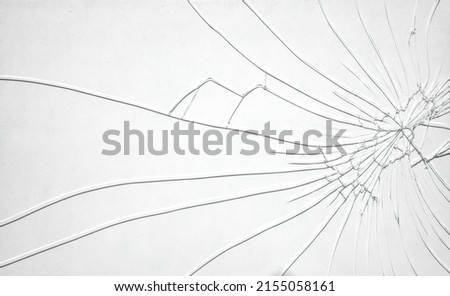 Cracks on the glass.White background in cracks.A broken smartphone screen. Screen replacement.The crack is black on a white background.