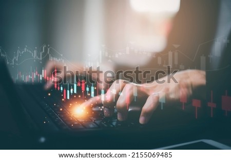 Businessman interacting with laptops, phones, and tablets with featuring stock tickers or graphs, cryptocurrency and new trading platforms, ideas and perspectives, Stock investment,New technology  Royalty-Free Stock Photo #2155069485