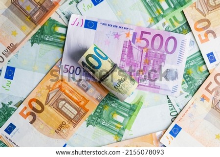 Euro in stationery band on pile of paper banknotes five one hundred and fifty euro. Heap of money Royalty-Free Stock Photo #2155078093