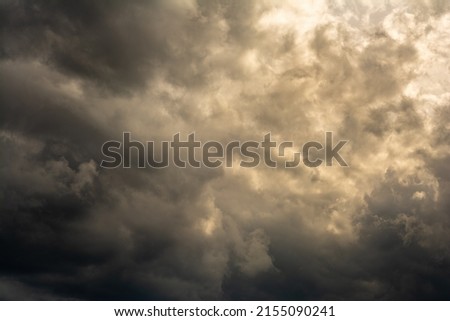 dramatic mystical sky with dense clouds and back sunlight. artistic moody picture for the original background, layout or decoration