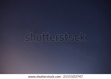 Shooting star flight in the night sky.