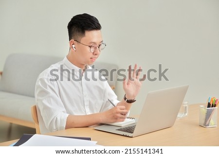 A moment of young working with laptop at home in living room background 