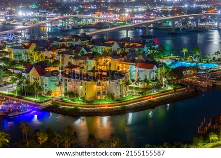 Harborside Villas aerial view at Nassau Harbour with Nassau downtown at the background at night, from Paradise Island, Bahamas. Royalty-Free Stock Photo #2155155587