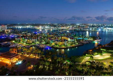 Harborside Villas aerial view at Nassau Harbour with Nassau downtown at the background at night, from Paradise Island, Bahamas. Royalty-Free Stock Photo #2155155591