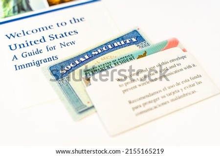 Close up of United States Permanent Resident Card (Green Card) and Social Security Number. Welcome to the United States of America.  Royalty-Free Stock Photo #2155165219