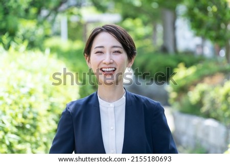 Asian woman in a cute suit Royalty-Free Stock Photo #2155180693