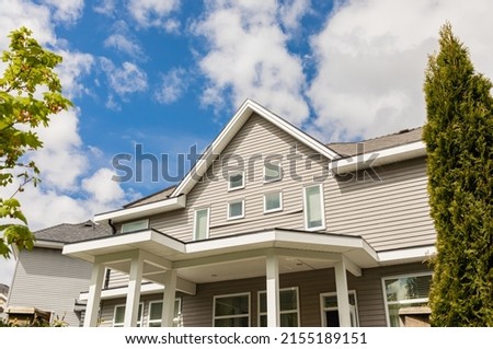 Neighborhood modern houses in BC, Canada. Canadian modern residential architecture. Facade of the house. Nobody, street photo Royalty-Free Stock Photo #2155189151