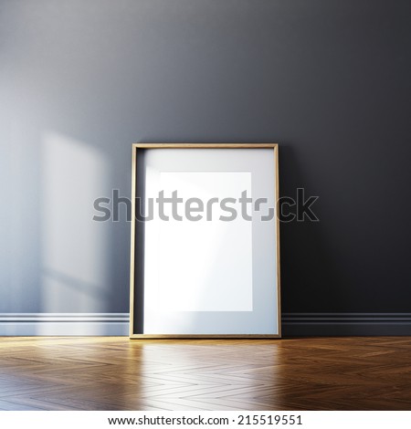 Blank picture frame and sunlight on a wall