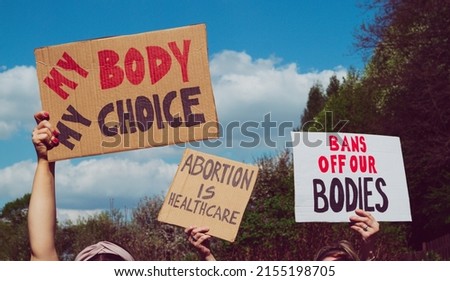 Protesters holding signs My Body My Choice, Bans Off Our Bodies, Abortion Is Healthcare. People with placards supporting abortion rights at protest rally demonstration. Royalty-Free Stock Photo #2155198705